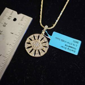 2.15CTW Moissanite Sun star pendant in gold over sterling on 20" chain.